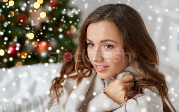 happy young woman with plaid at home for christmas Stock photo © dolgachov