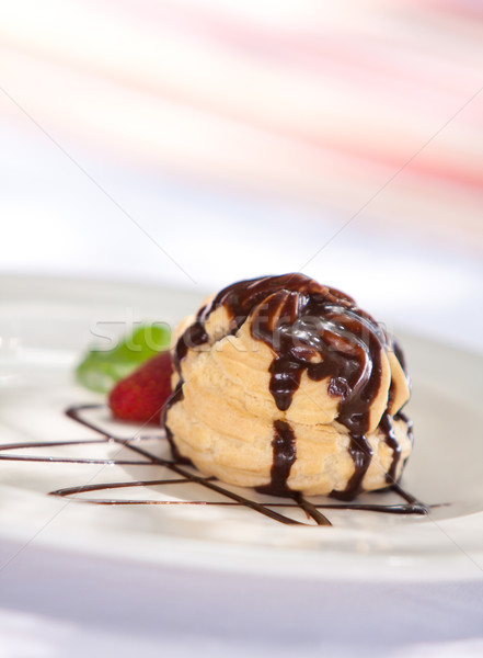 Chocolate profiteroles with ice cream on a plate Stock photo © Donvanstaden
