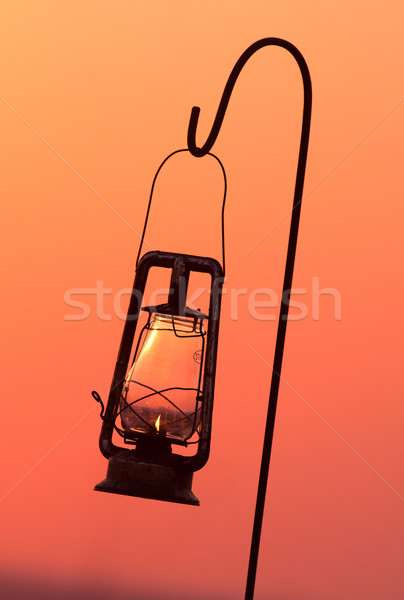 Hurricane lamp in silhouette Stock photo © Donvanstaden