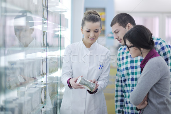 pharmacist suggesting medical drug to buyer in pharmacy drugstore Stock photo © dotshock