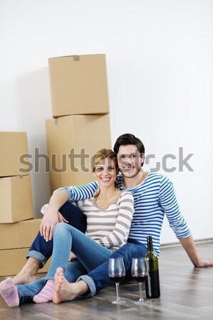 Fiatal pér mozog új ház boldog férfi otthon Stock fotó © dotshock