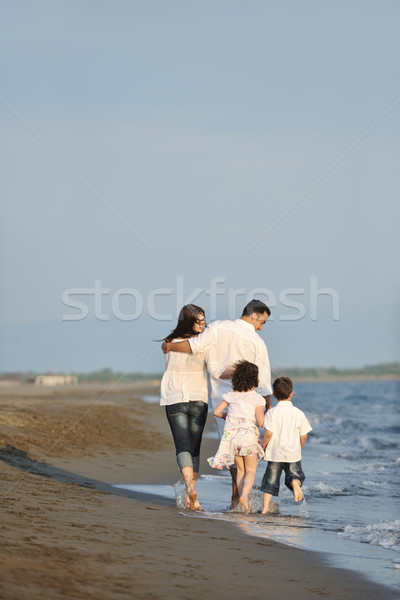 Stock photo: happy young family have fun on beach at sunset