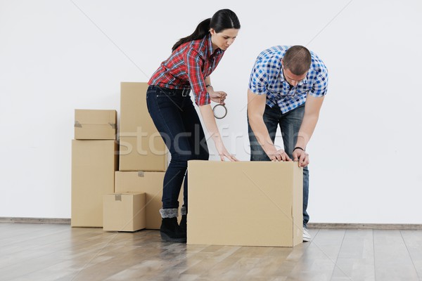Young couple moving in new house Stock photo © dotshock