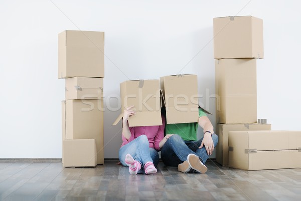 Young couple moving in new house Stock photo © dotshock