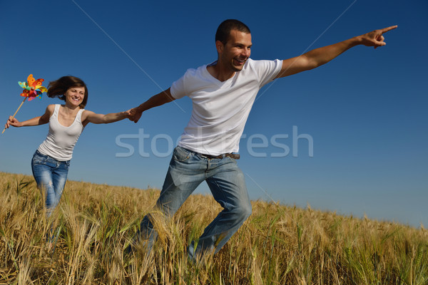 Stock photo: happy couple in wheat field