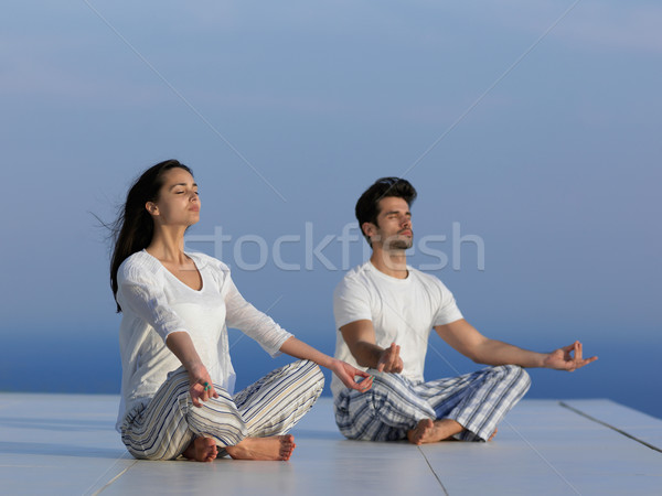 young couple practicing yoga Stock photo © dotshock
