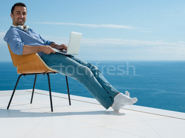 Stock foto: Entspannt · junger · Mann · home · Balkon · gut · aussehend · entspannenden