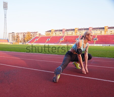 Athletic woman running on track Stock photo © dotshock