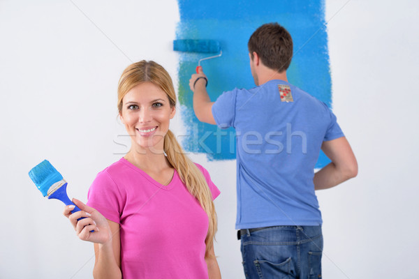 Boldog pár festék fal új otthon fiatal pér Stock fotó © dotshock