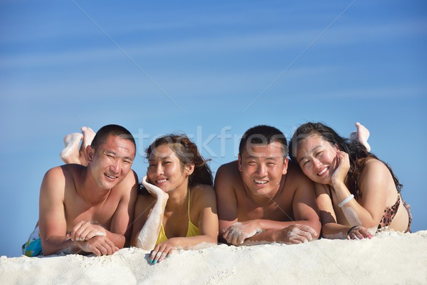 Stock photo: group of happy young people have fun on bach