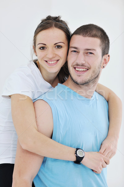 happy young couple fitness workout and fun Stock photo © dotshock