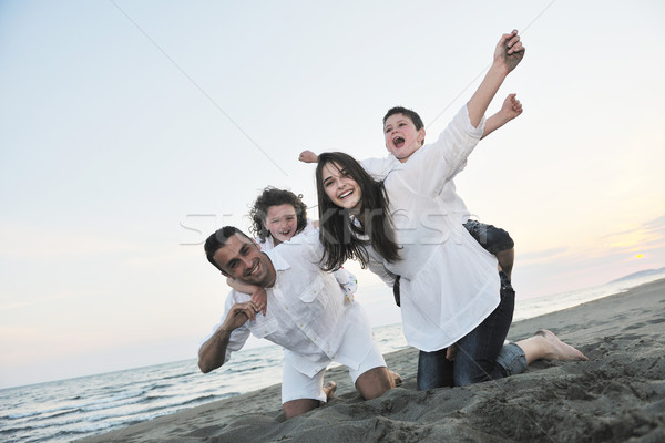 счастливым молодые семьи весело пляж жить Сток-фото © dotshock