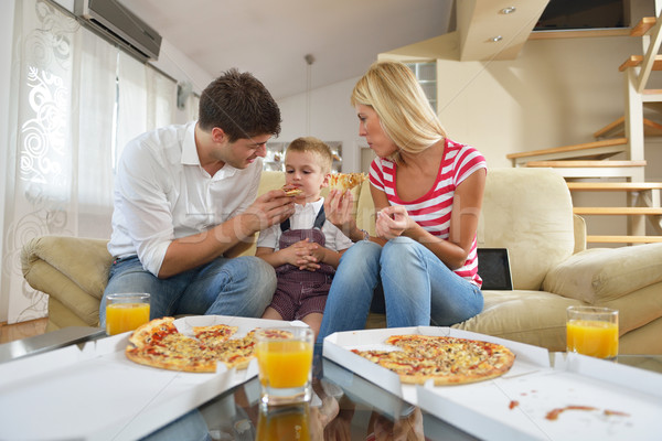 family eating pizza Stock photo © dotshock