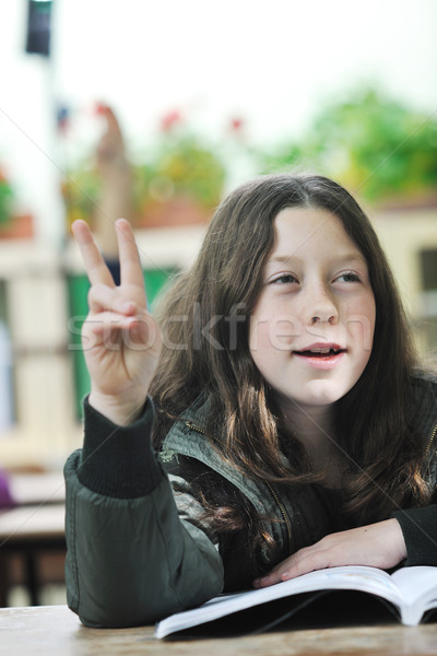 happy child  in schoold have fun and learning leassos Stock photo © dotshock