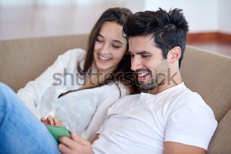 Stock photo: happy young couple relax at home