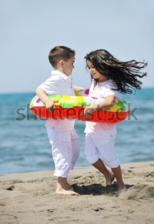 Stock photo: happy child group playing  on beach