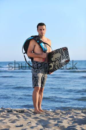 Portrait of a young  kitsurf  man at beach on sunset Stock photo © dotshock