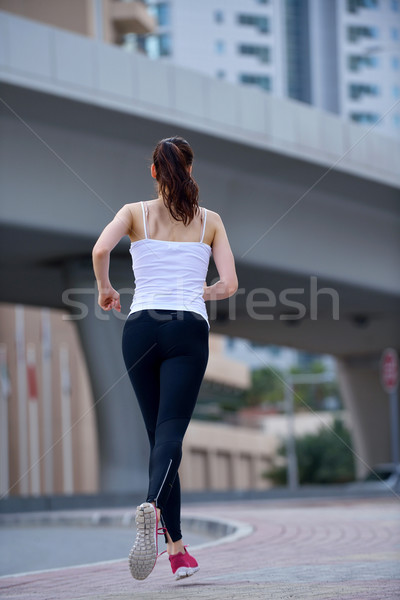Mujer correr manana ejecutando ciudad parque Foto stock © dotshock