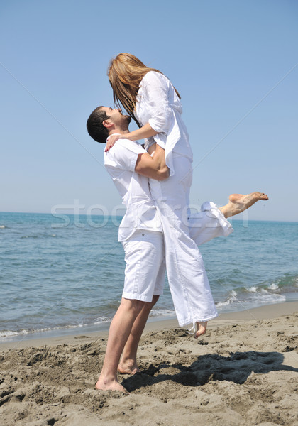 happy young couple have fun on beach Stock photo © dotshock