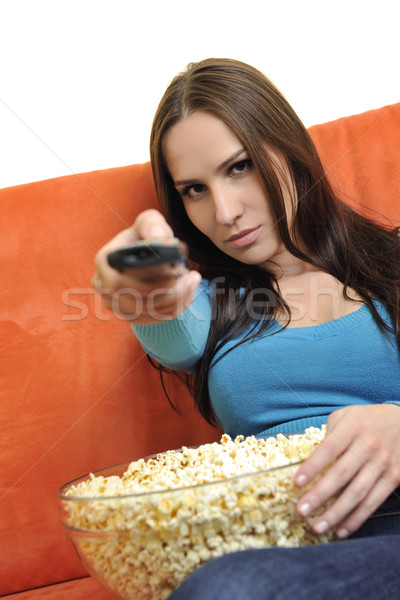 ストックフォト: 若い女性 · 食べる · ポップコーン · を見て · テレビ · 映画