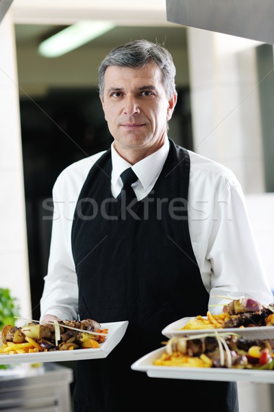 Stock photo: male chef presenting food