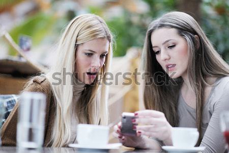 Stock photo: cute smiling women drinking a coffee