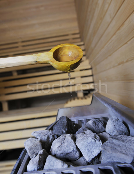 hot stones and splashing water in sauna Stock photo © dotshock