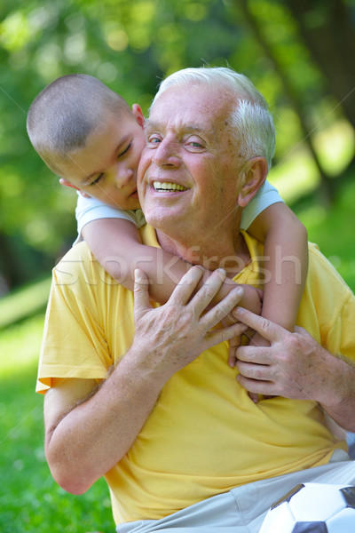 Boldog nagyapa gyermek park jókedv játék Stock fotó © dotshock