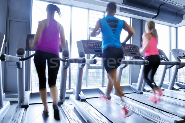 Group of people running on treadmills Stock photo © dotshock