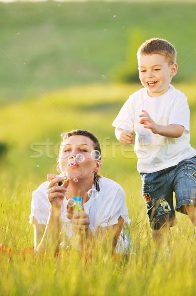 женщину ребенка пузыря счастливым Открытый играет Сток-фото © dotshock