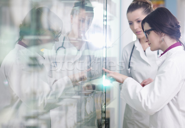 team of pharmacist chemist woman  in pharmacy drugstore Stock photo © dotshock