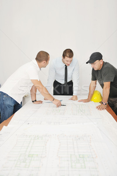 Stock photo: Team of architects on construciton site