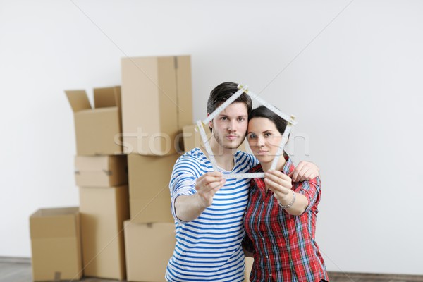 Young couple moving in new house Stock photo © dotshock