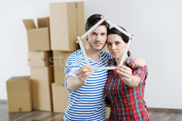 Stock photo: Young couple moving in new house