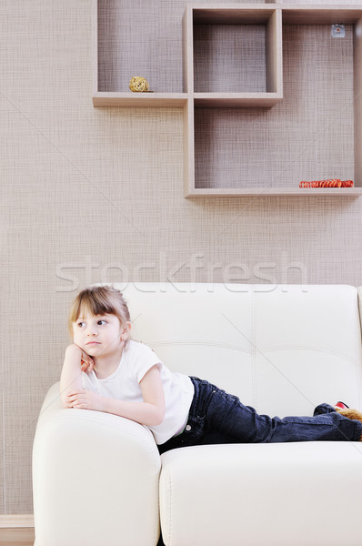 Cute dziewczyna sofa motyka dziewczynka domu Zdjęcia stock © dotshock
