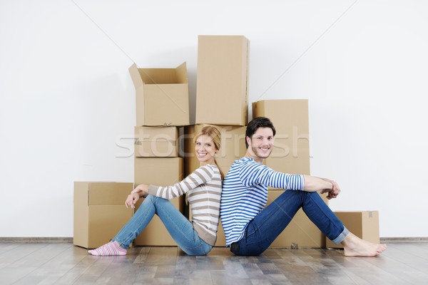 Young couple moving in new house Stock photo © dotshock