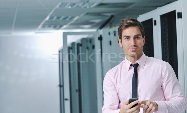 it engeneer talking by phone at network room Stock photo © dotshock