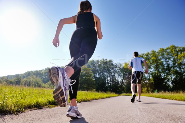 Fiatal pér jogging park reggel egészség fitnessz Stock fotó © dotshock