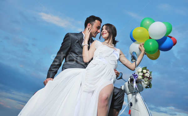 just married couple on the beach ride white scooter Stock photo © dotshock