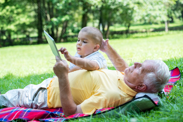 Nagyapa gyermek park tabletta táblagép szeretet Stock fotó © dotshock