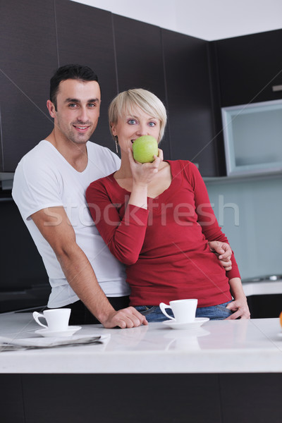 young couple have fun in modern kitchen Stock photo © dotshock