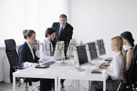 Pessoas de negócios grupo trabalhando cliente ajudar secretária Foto stock © dotshock