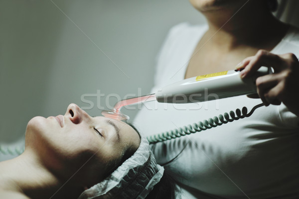 woman with facial mask in cosmetic studio Stock photo © dotshock