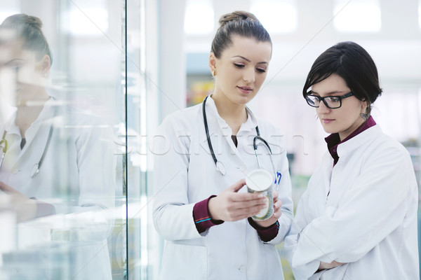 team of pharmacist chemist woman  in pharmacy drugstore Stock photo © dotshock