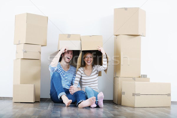Young couple moving in new house Stock photo © dotshock