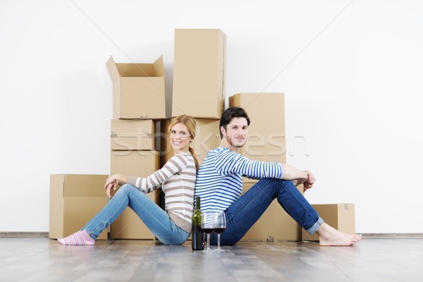 Young couple moving in new house Stock photo © dotshock