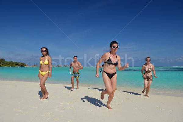 group of happy young people have fun on bach Stock photo © dotshock