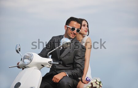 just married couple on the beach ride white scooter Stock photo © dotshock