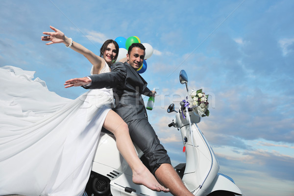 just married couple on the beach ride white scooter Stock photo © dotshock