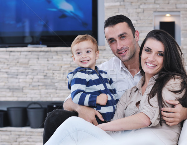 happy young family have fun  with tv in backgrund Stock photo © dotshock